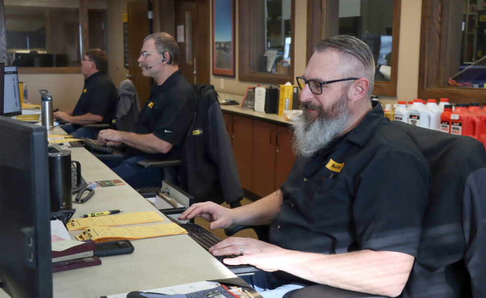 Two Butler employees working at computers