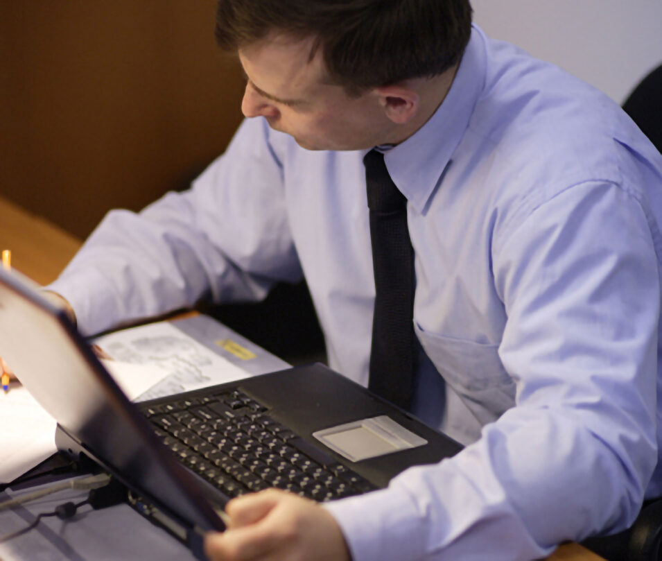 Man looking at laptop computer.