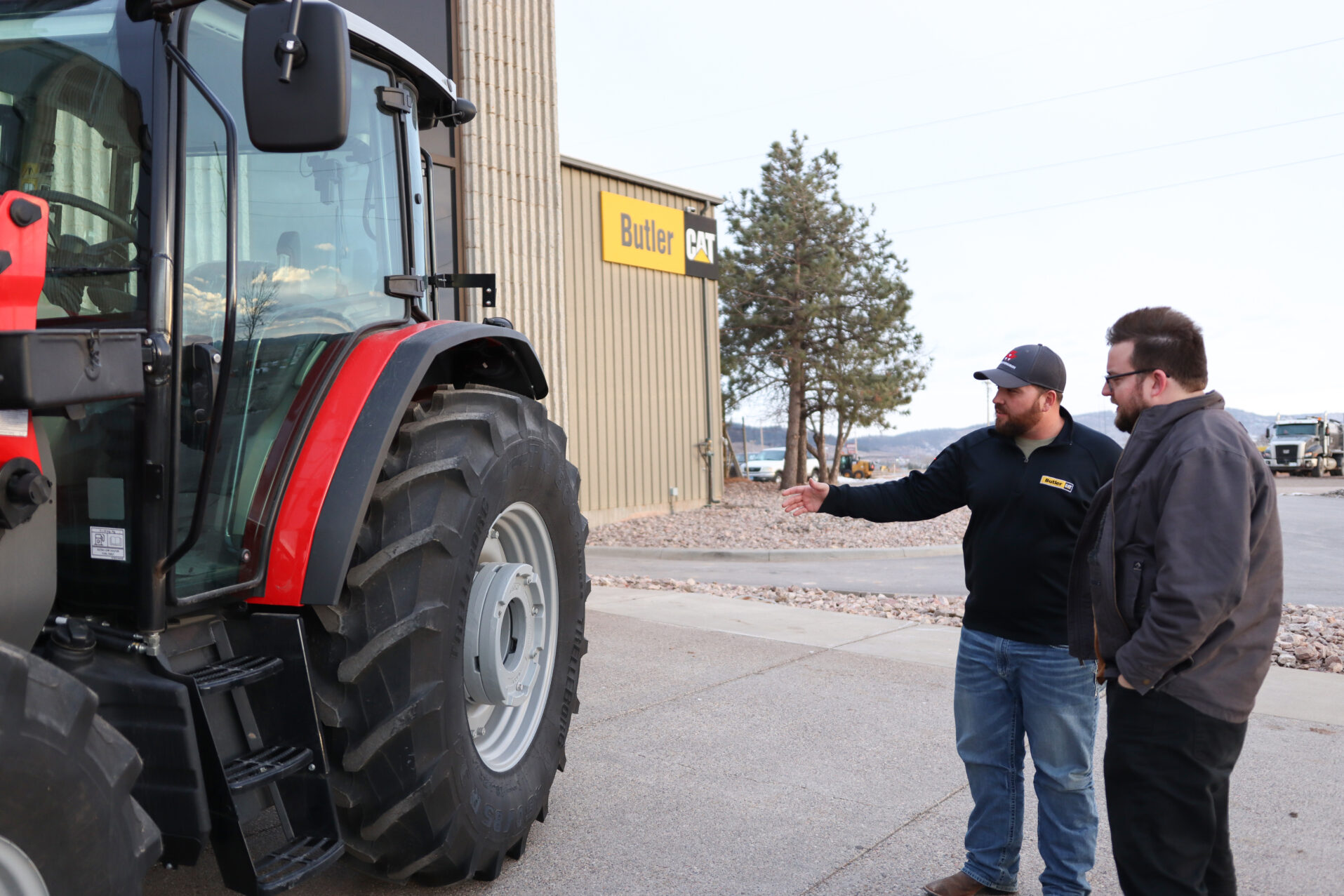 Man showing another man equipment.
