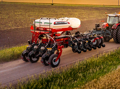 Massey Ferguson Planter driving down the road